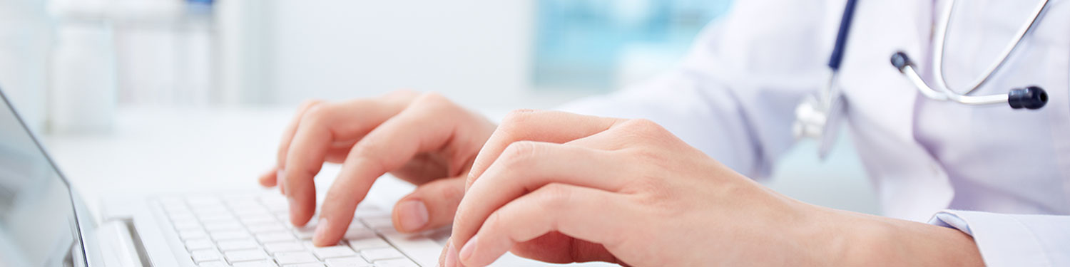 nurse typing at keyboard