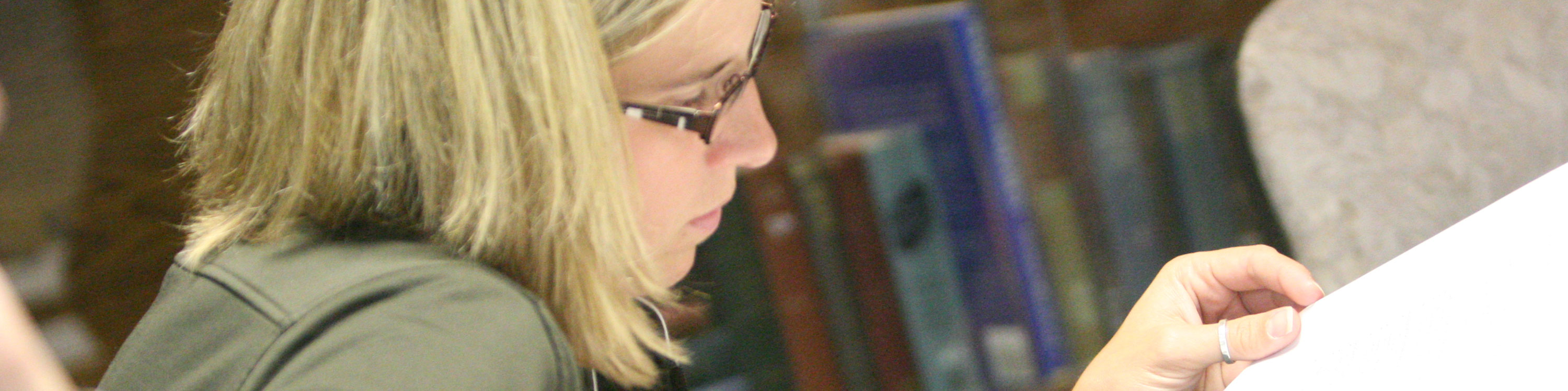 Female student looking at papers