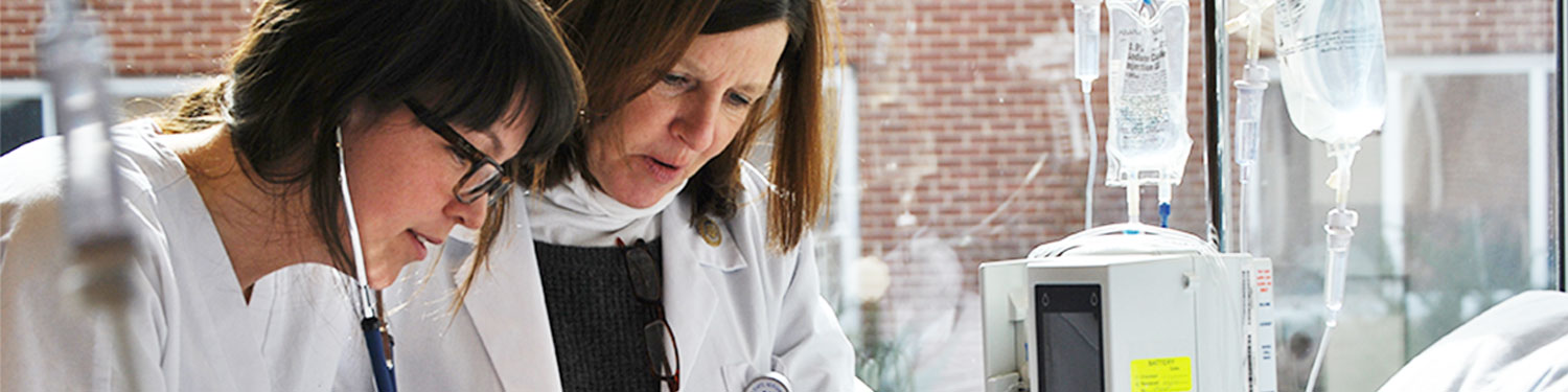 nurse giving student instruction